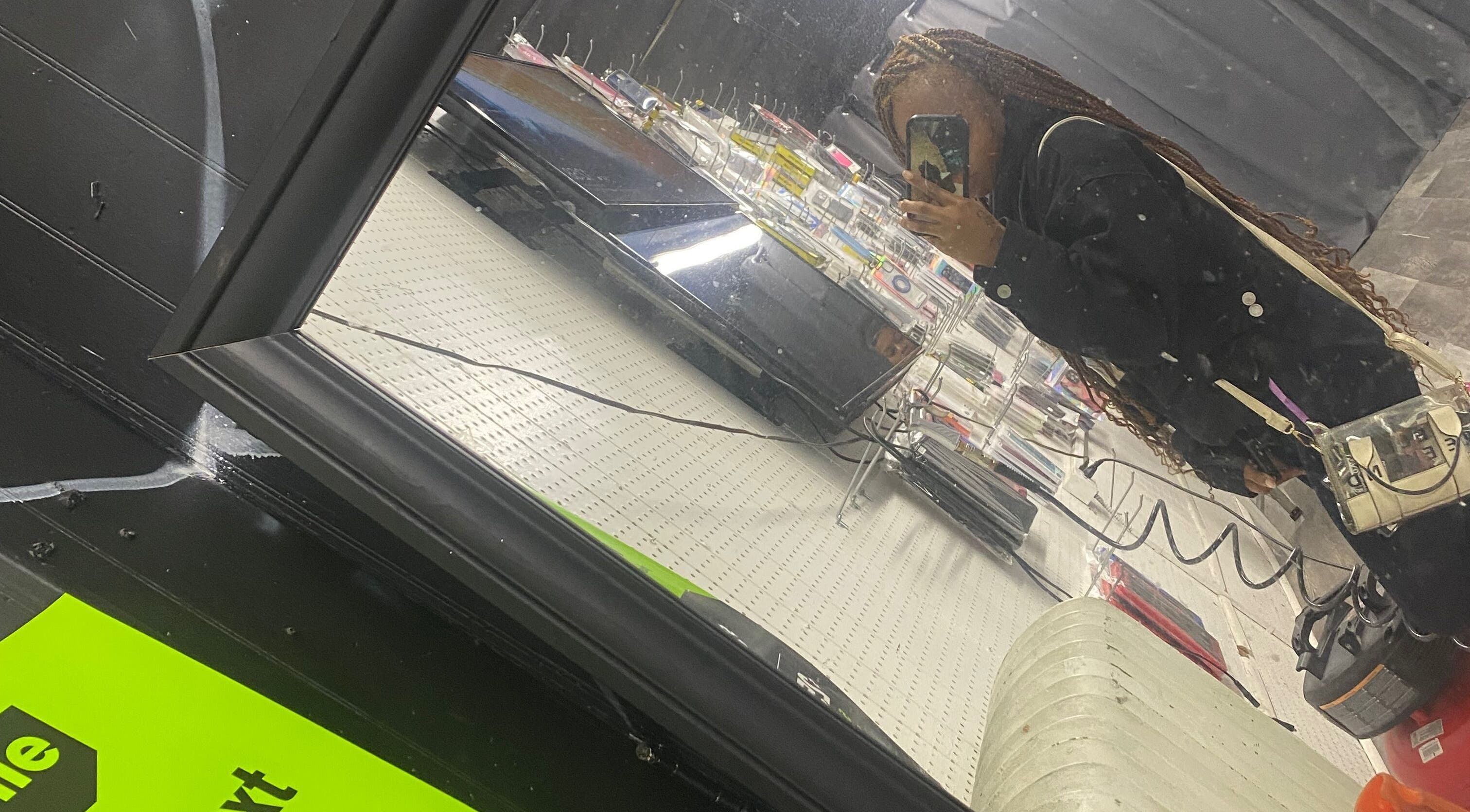 Client's reflection in mirror at slayedbyjaylamarie, Philadelphia, Pennsylvania, US