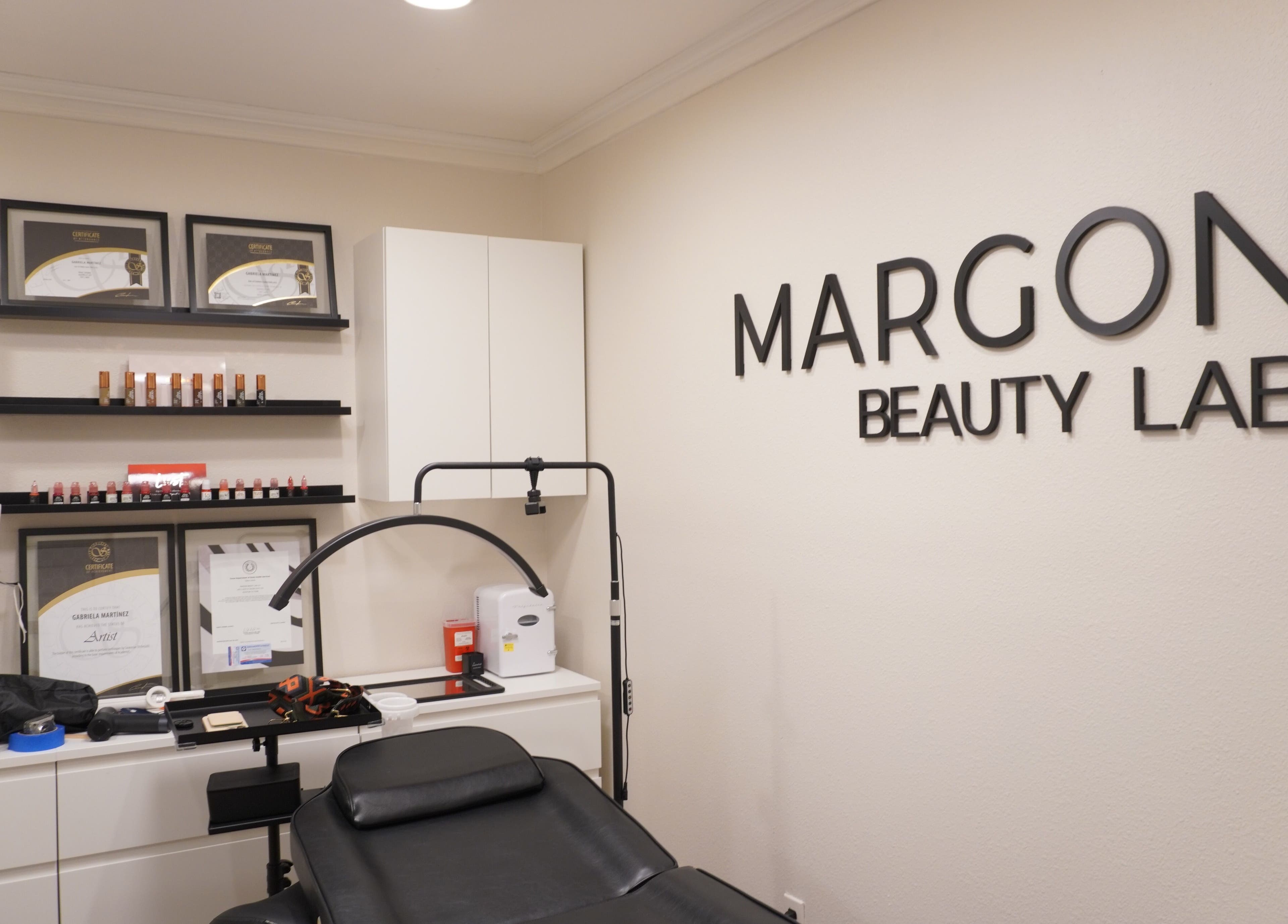 Interior of MARGON BEAUTY LAB in Houston, Texas, showcasing treatment room with certifications displayed.