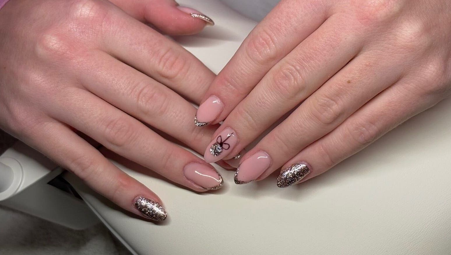 Elegant glittery nail art at PolishedbyChantelle, Pembroke Dock, Wales, GB. Perfect for special occasions.