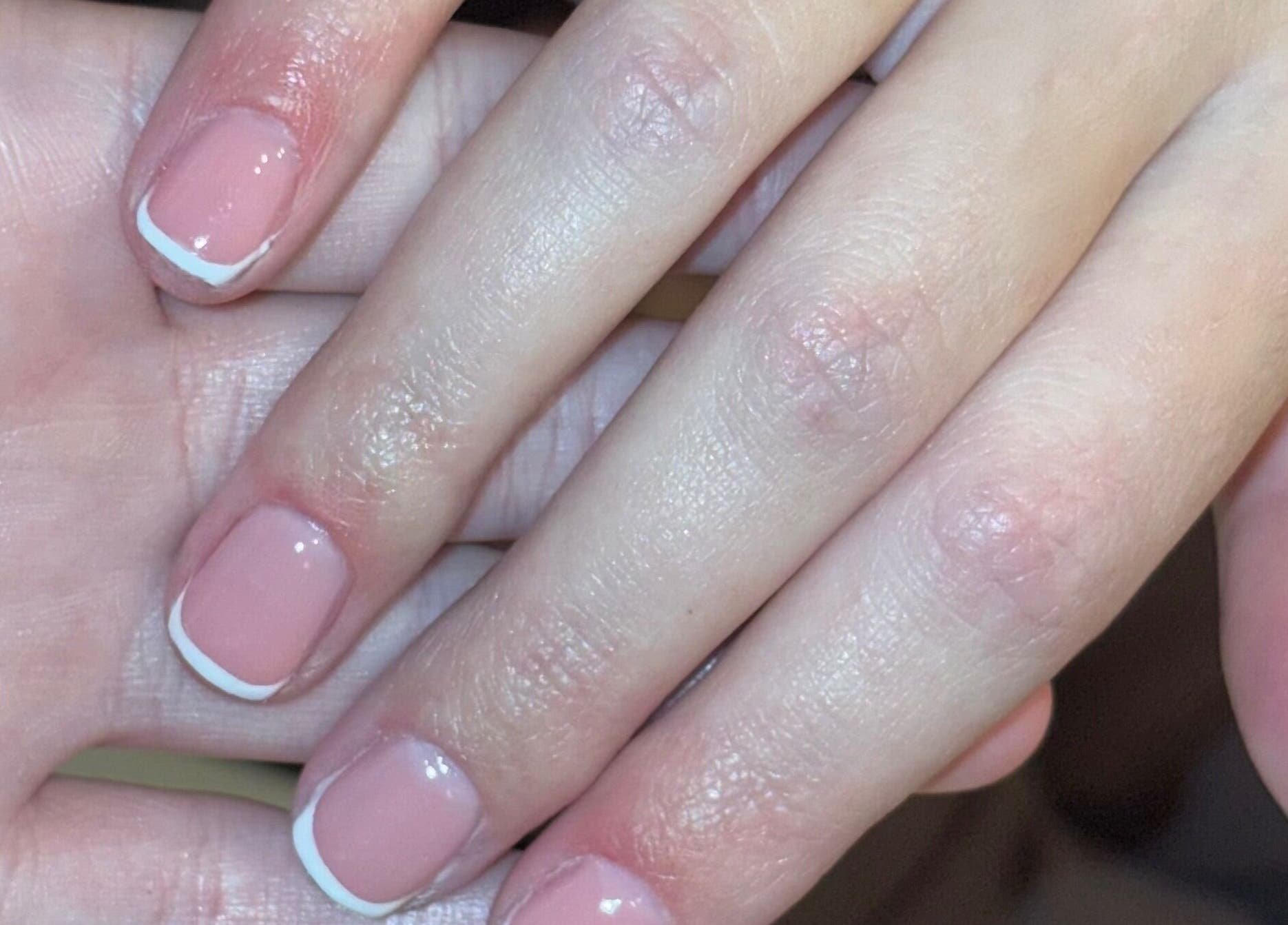Stylish French manicure by PolishedbyChantelle in Pembroke Dock, Wales, GB showcasing glossy pink nails.