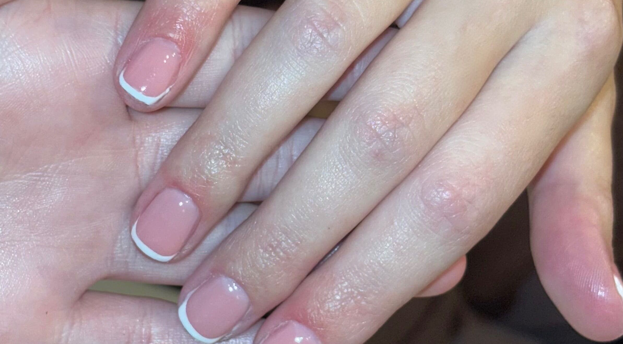 Stylish French manicure by PolishedbyChantelle in Pembroke Dock, Wales, GB showcasing glossy pink nails.