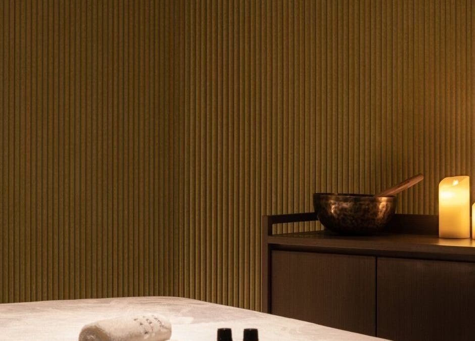 Relaxing candlelit massage room at Glow Haus in Montgomery, Alabama, US, featuring soothing ambience.