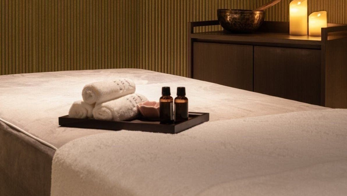 Luxurious massage table setup with oils at Glow Haus, Montgomery, Alabama, US offering ultimate relaxation.