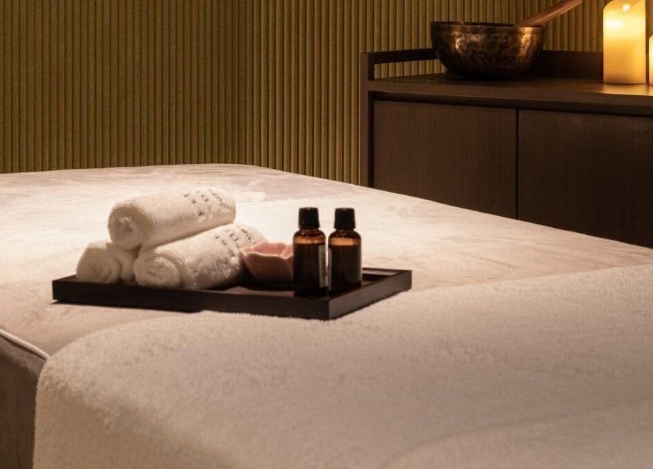 Luxurious massage table setup with oils at Glow Haus, Montgomery, Alabama, US offering ultimate relaxation.