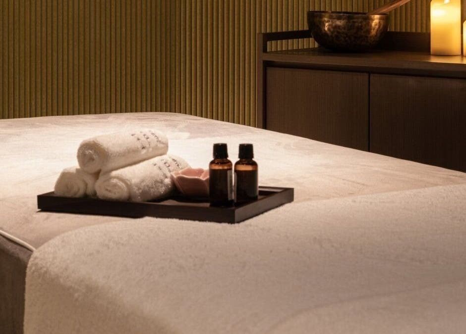 Relaxing massage room at Glow Haus, Montgomery, Alabama, US with candles and oils.