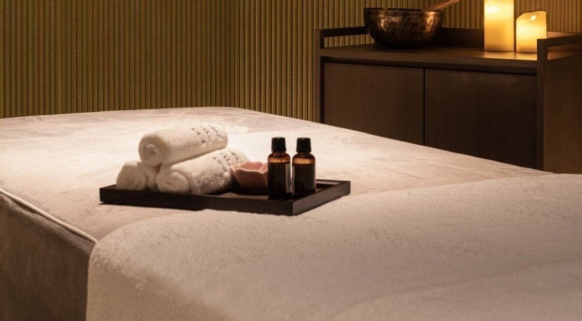 Relaxing massage room at Glow Haus, Montgomery, Alabama, US with candles and oils.