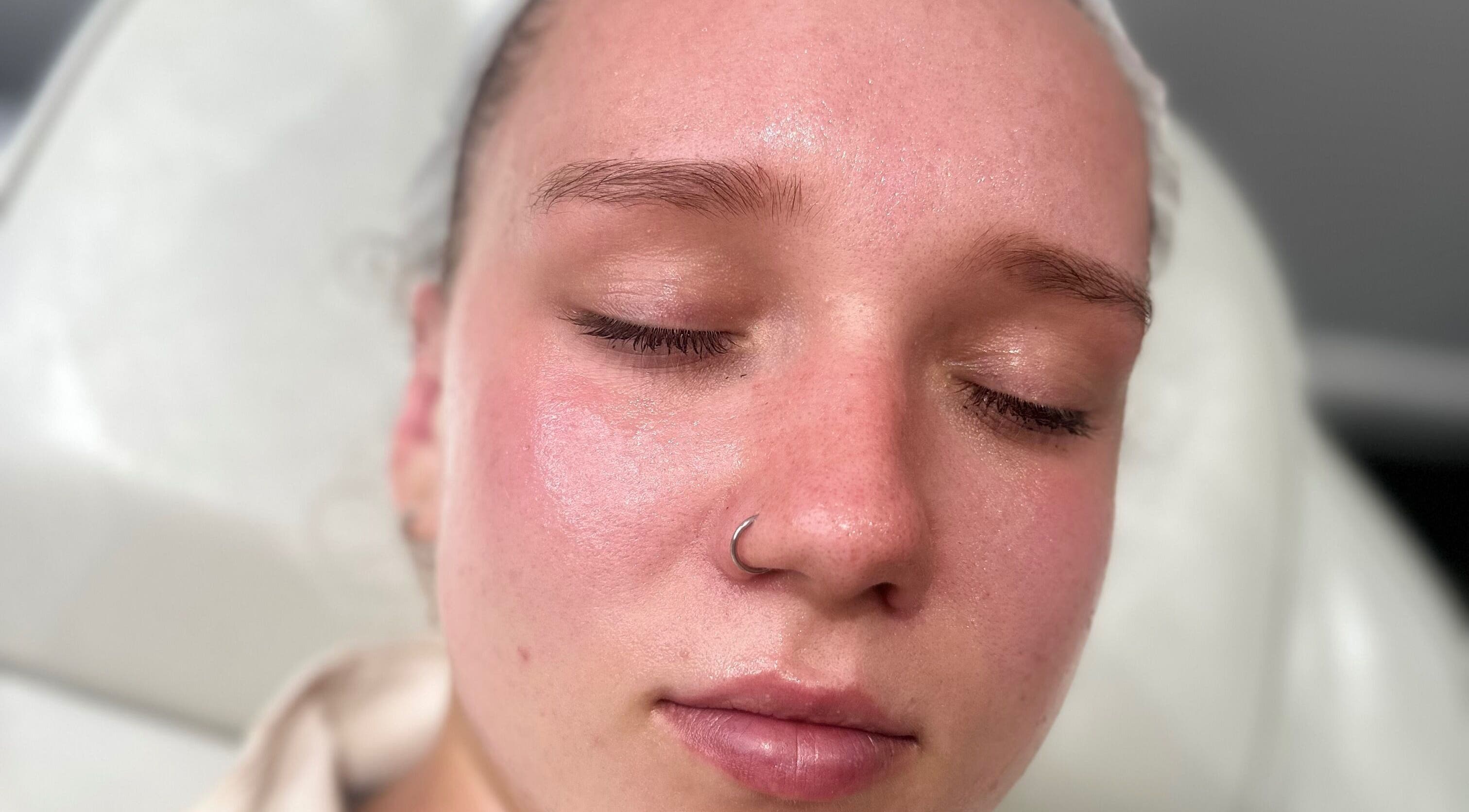 Relaxed client enjoying facial treatment at Pure Radiance by Shauna, Crook, England, GB.