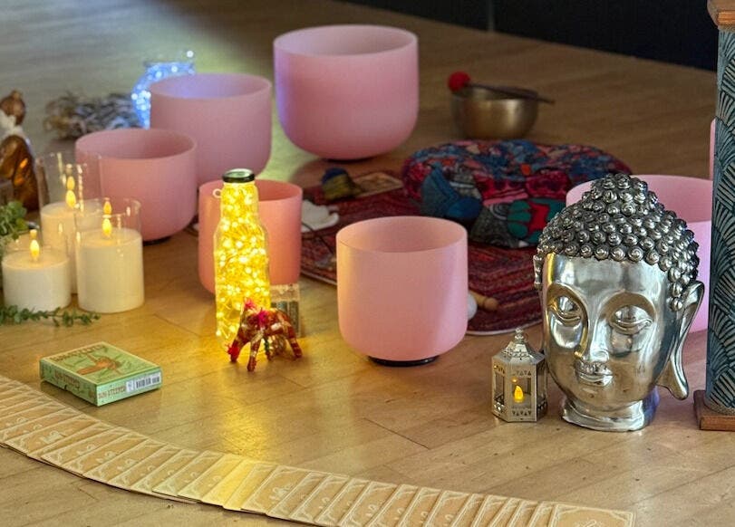 Peaceful meditation setup at Authentic Life Wellbeing, Stevenage, England, GB with candles and Buddha statue.