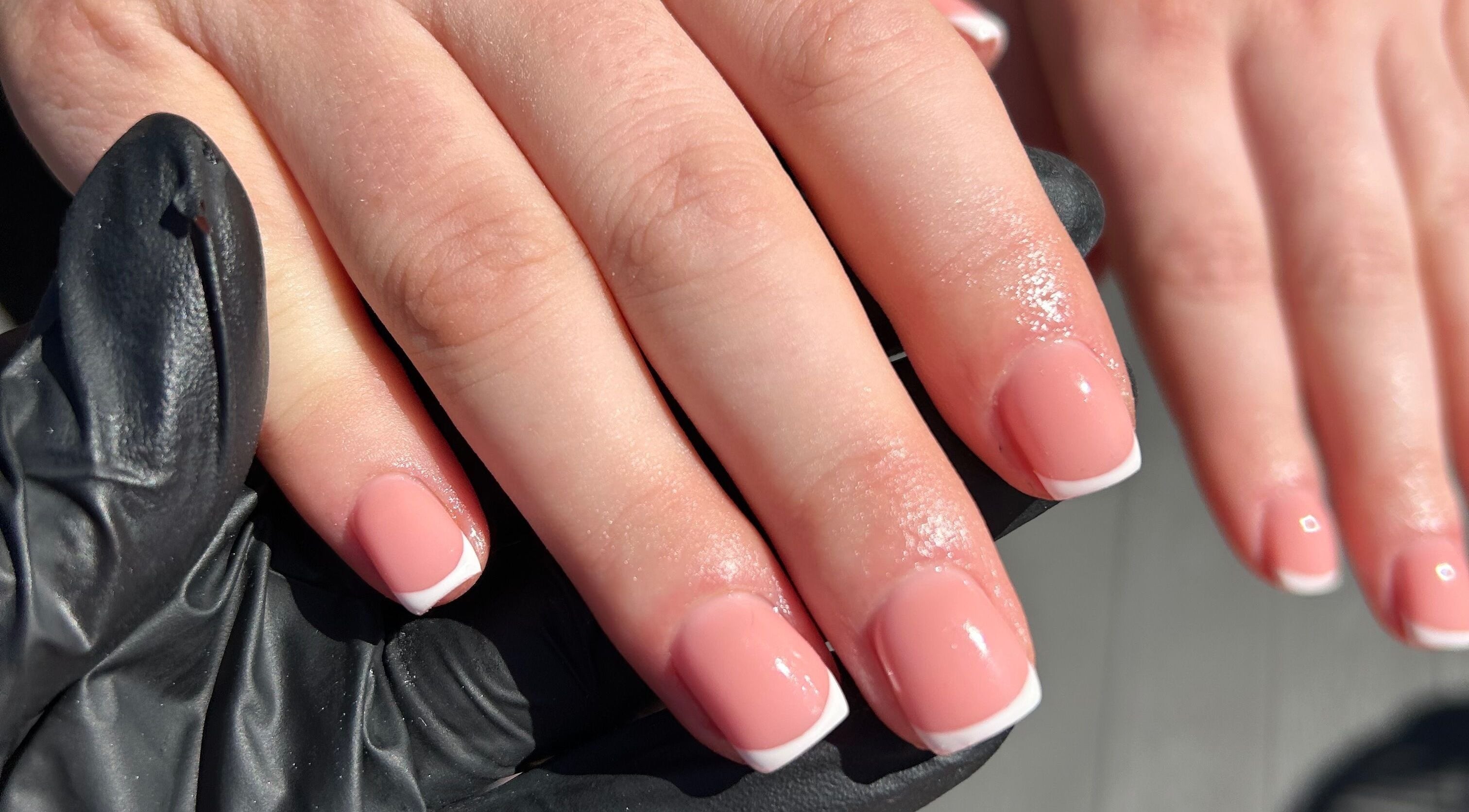 French manicure at By Brooke, Rainham, England, GB, showcasing chic and glossy nails.