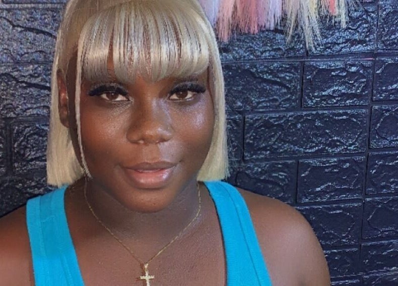 Smiling woman with blonde hair at SamSassyHair, Kingston, St. Andrew Parish, JM.