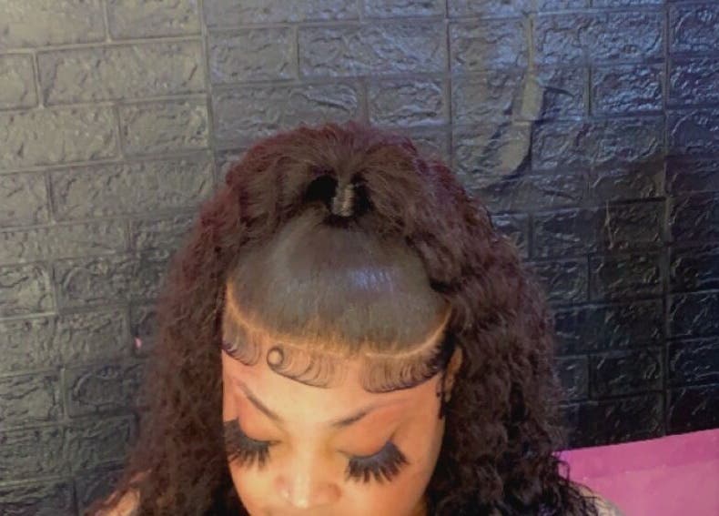 Beautiful curly hairstyle at SamSassyHair, Kingston, St. Andrew Parish, JM, showcasing expert styling.