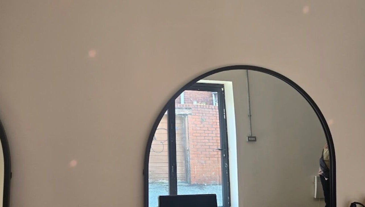 Elegant mirror view inside Tylerstoreyhair salon located in North Shields, England, GB.