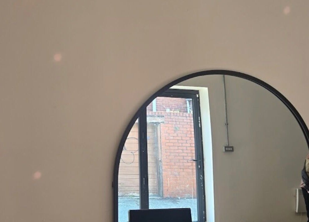Elegant mirror view inside Tylerstoreyhair salon located in North Shields, England, GB.