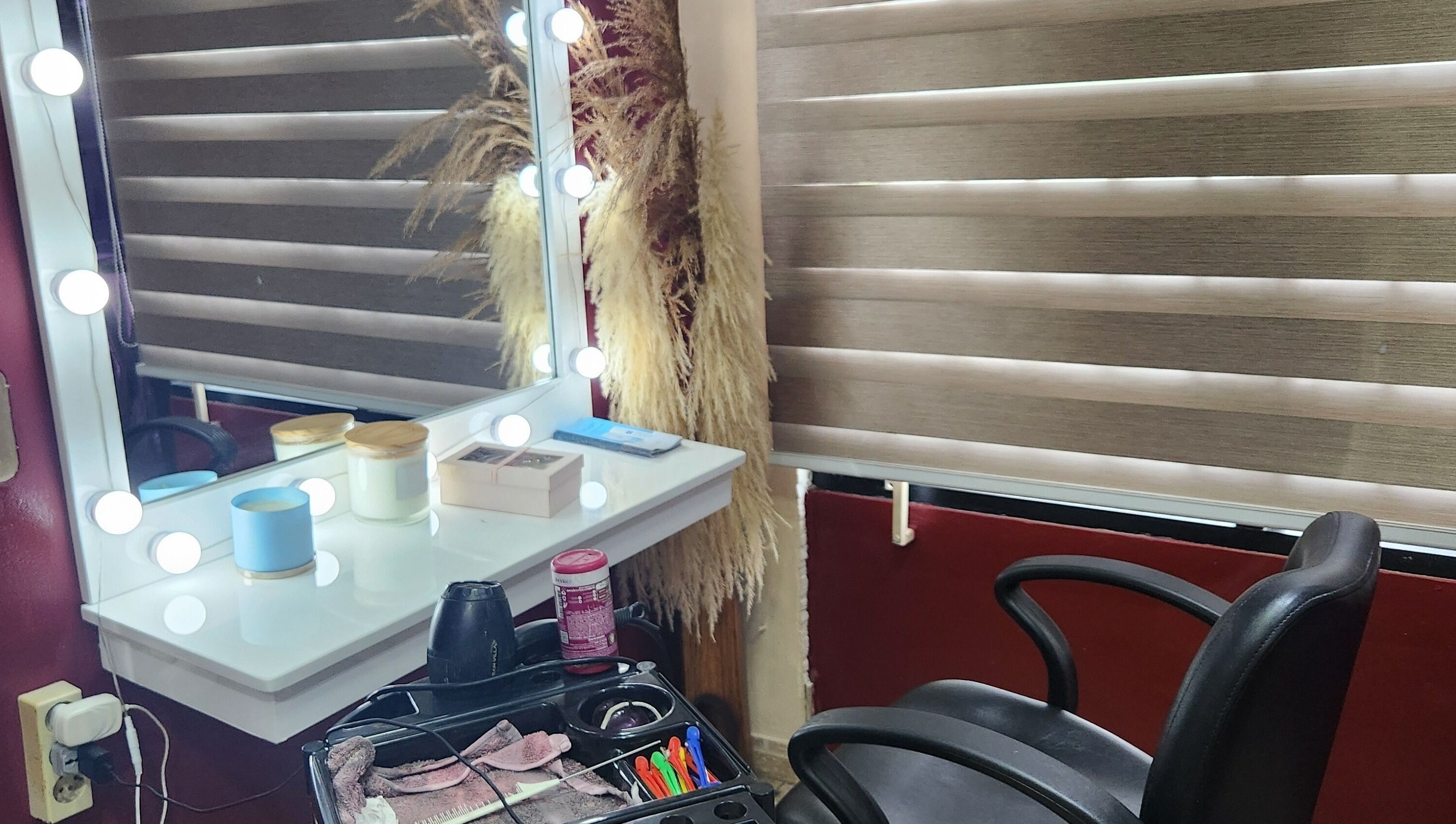 Beauty by Pascalle's elegant makeup station in Paramaribo Noord, SR, featuring a lit mirror and grooming tools.