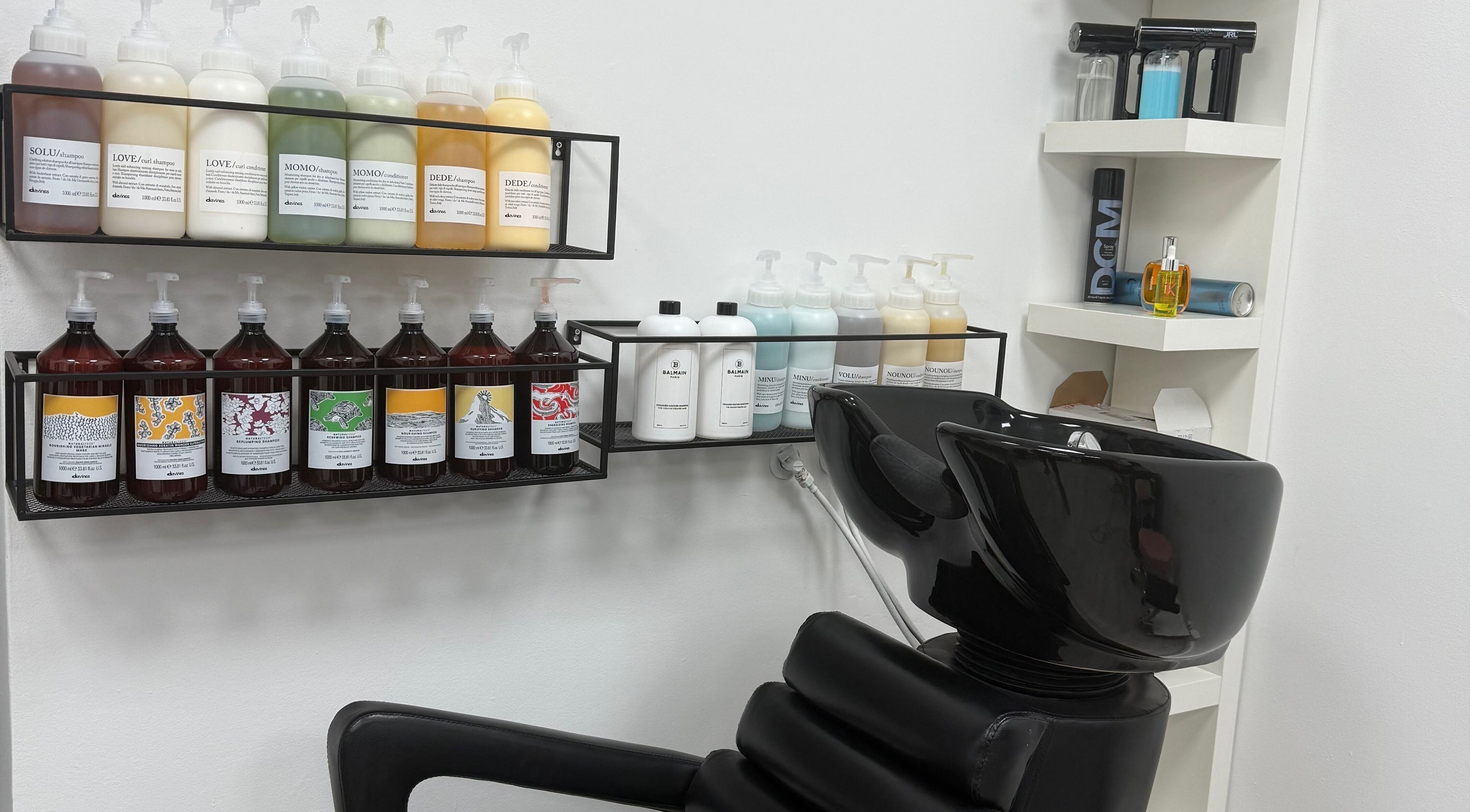 Sleek shampoo station at MM HAIR STUDIO, Sofia, Sofia, BG, offering premium haircare products.