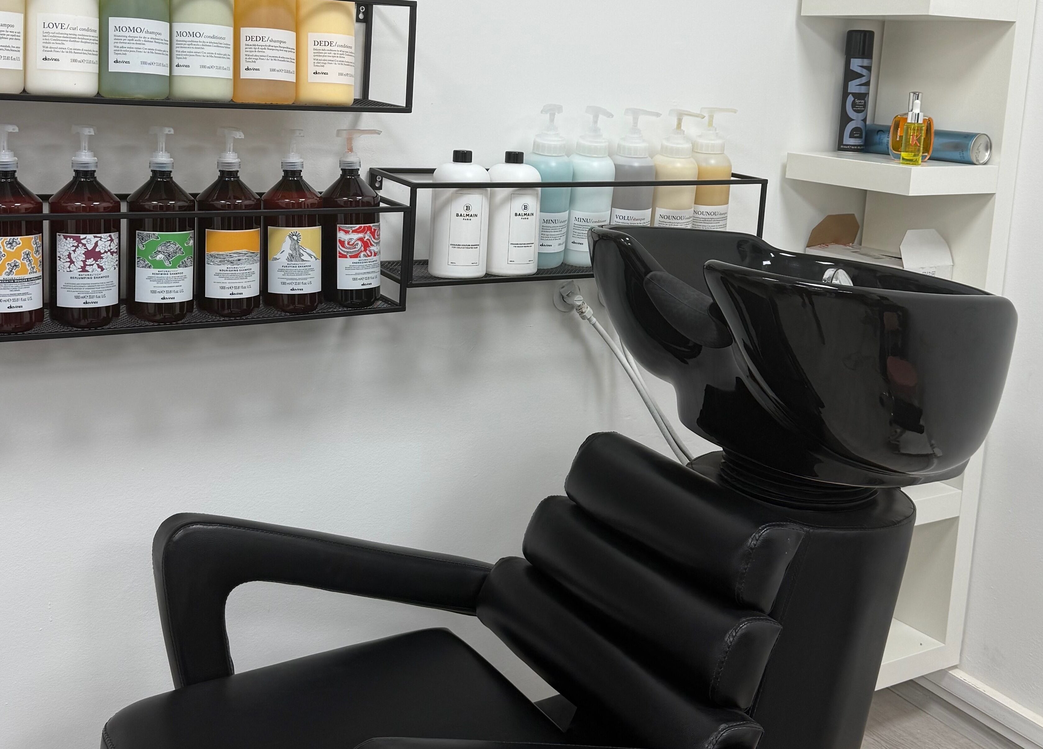 Modern wash station at MM HAIR STUDIO, Sofia, Sofia, BG showcasing stylish design and product display.