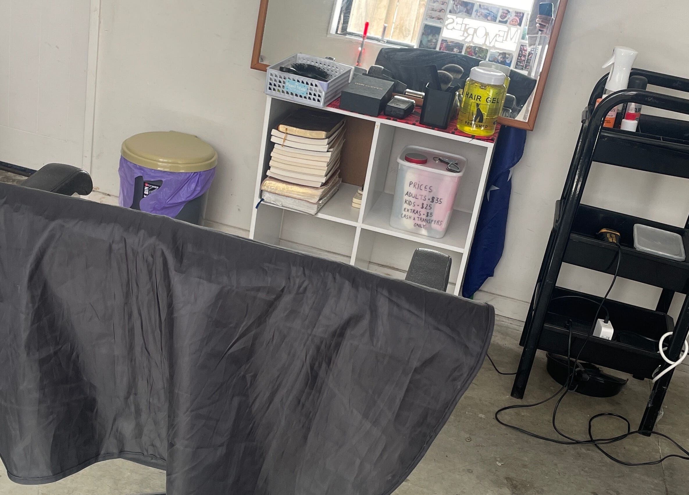 Modern salon station at South AKL cuts 09, Auckland, Auckland, NZ, featuring styling tools and hair products.