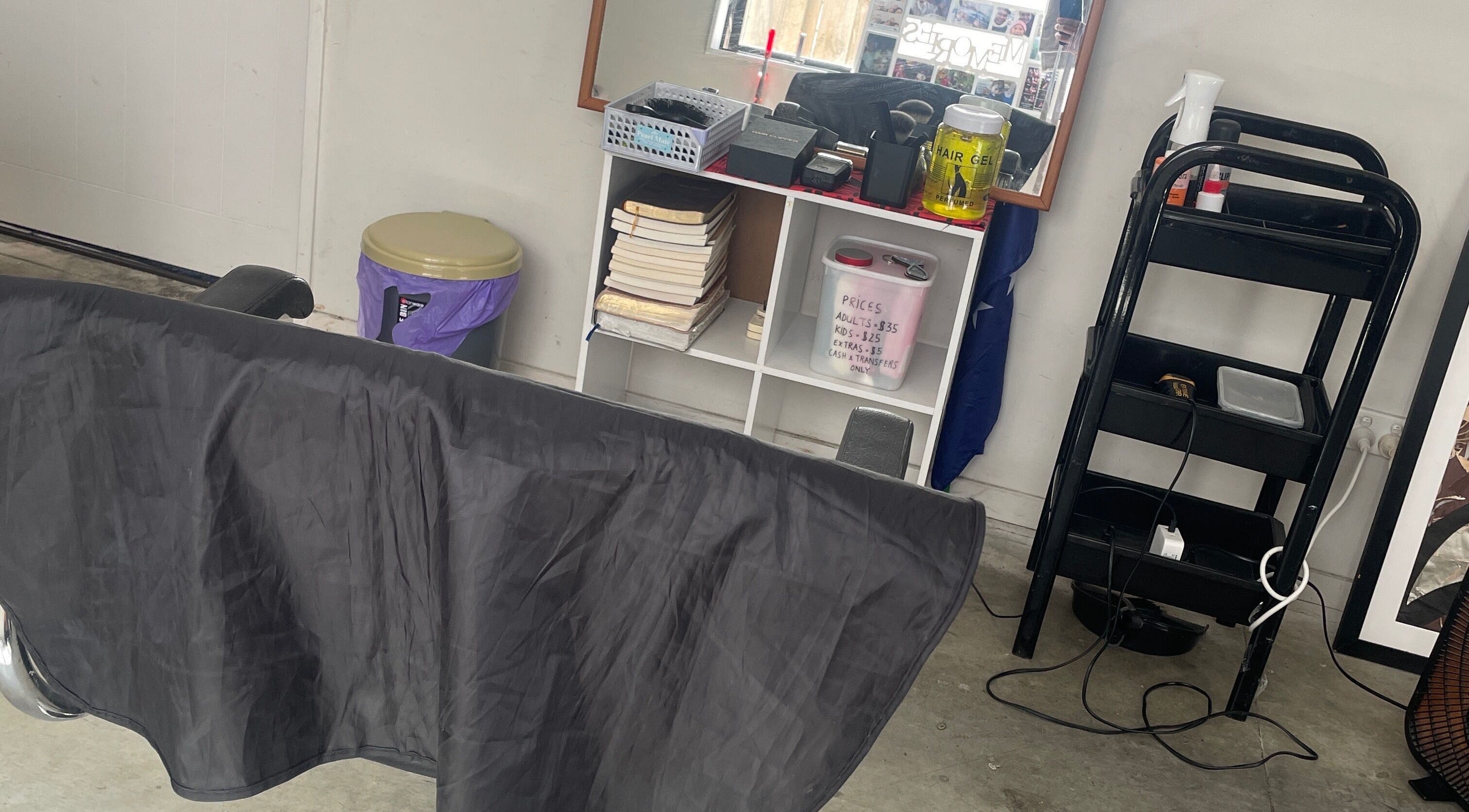 Modern salon station at South AKL cuts 09, Auckland, Auckland, NZ, featuring styling tools and hair products.