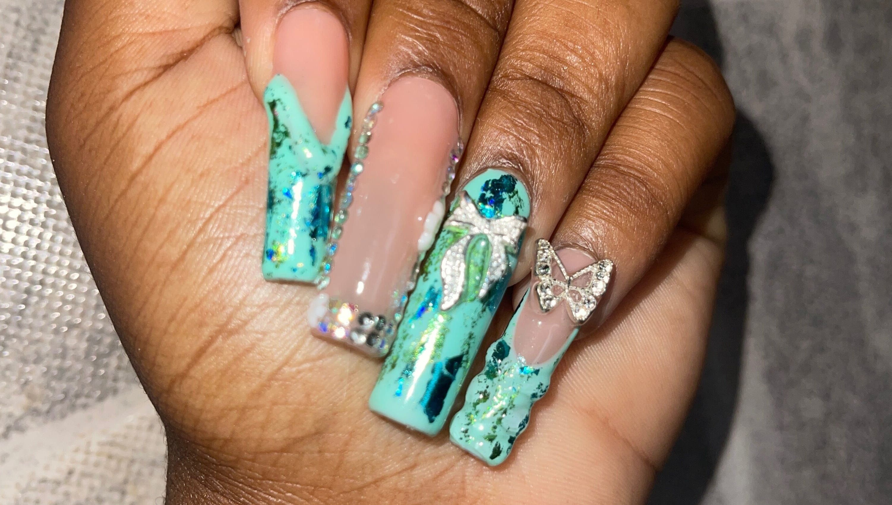 Stylish turquoise nail design with gems at Klawed.bymiah, Lowthers Hill, Christ Church, BB.