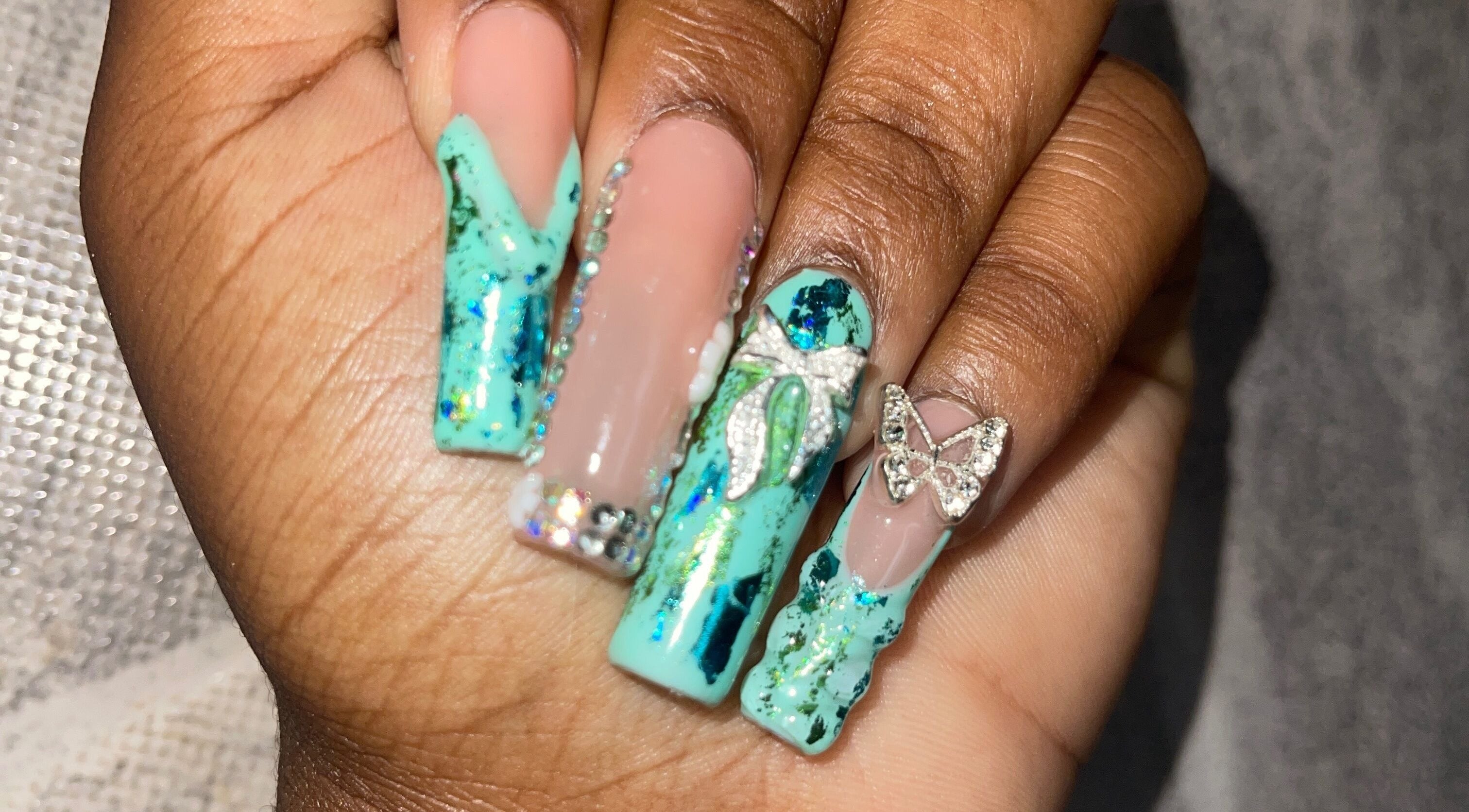 Stylish turquoise nail design with gems at Klawed.bymiah, Lowthers Hill, Christ Church, BB.