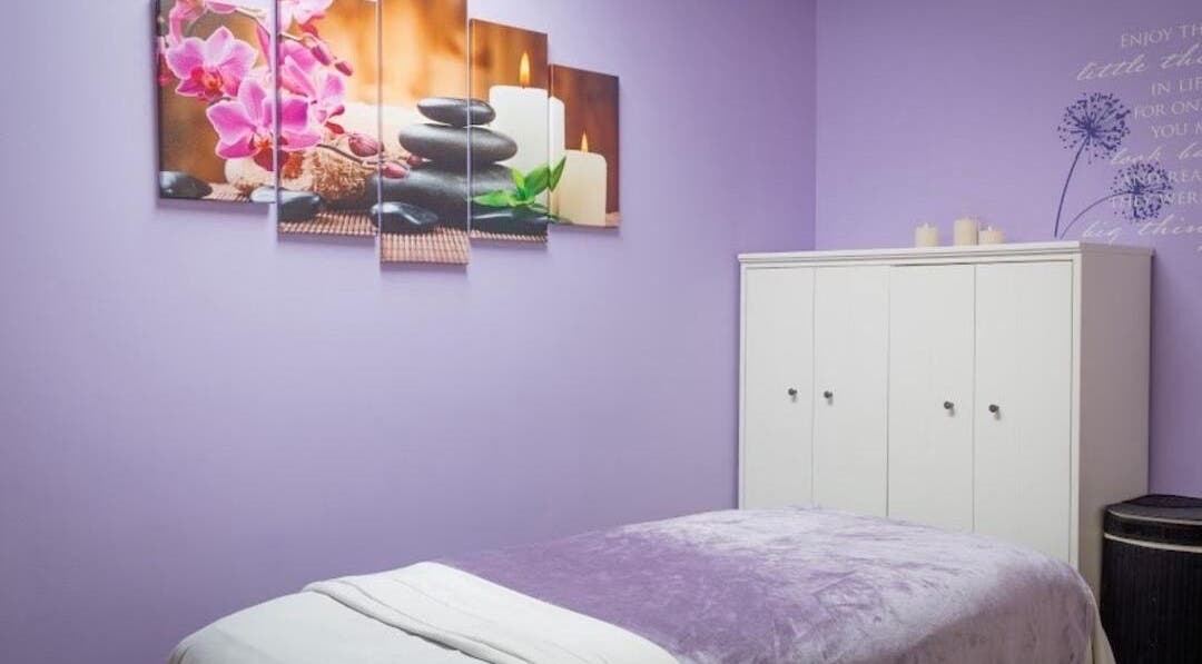 Relaxing massage room at Serenity Haven Spa, Schenectady, New York, US with calming decor and candles.