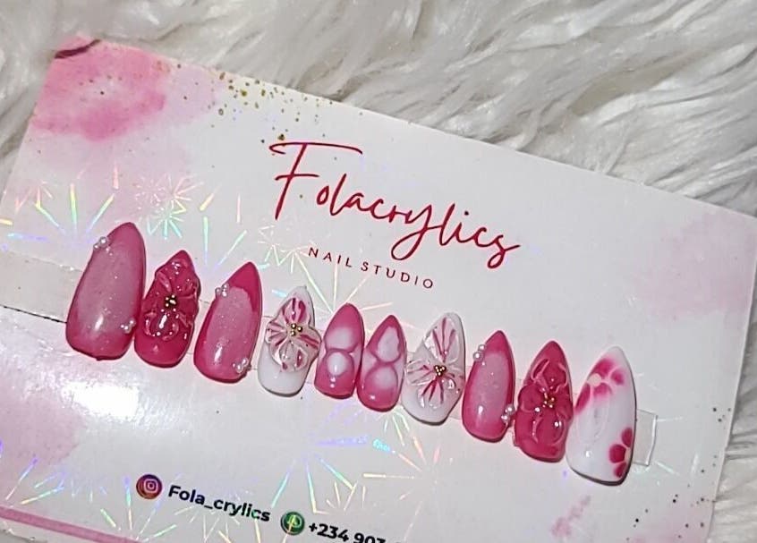 Dazzling nail art designs at Folacrylics, Lagos, Lagos, NG, displayed on a textured backdrop.