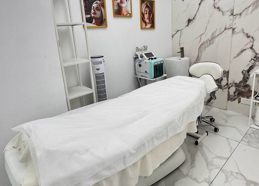 Cozy treatment room at Lul Beauty Salon, Dubai, Dubai, AE with a plush bed and elegant decor.
