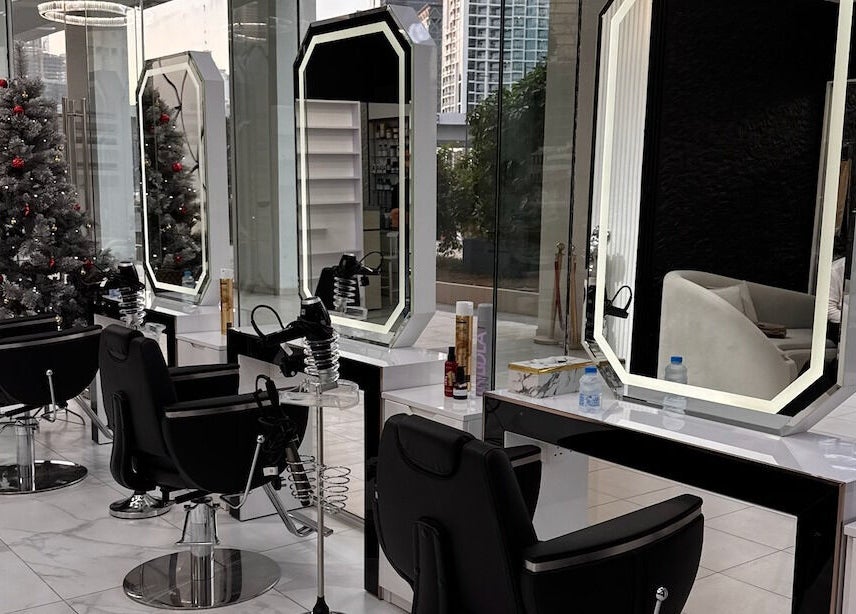 Elegant styling stations inside Lul Beauty Salon, Dubai, Dubai, AE, featuring modern mirrors and salon chairs.