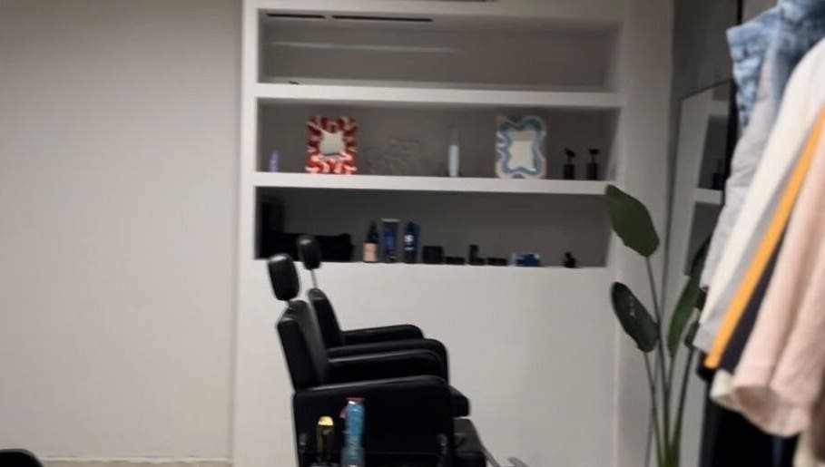 Modern salon interior at ORBIT CREW, San Nicolás De Los Arroyos, Provincia De Buenos Aires, AR showcases stylish decor.