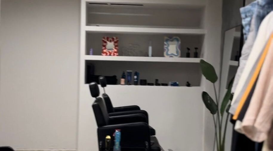 Modern salon interior at ORBIT CREW, San Nicolás De Los Arroyos, Provincia De Buenos Aires, AR showcases stylish decor.