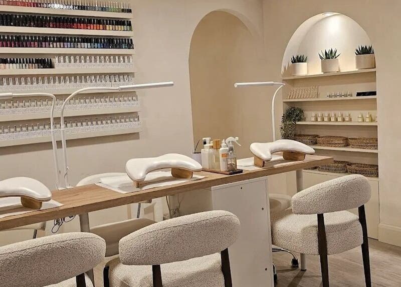 Modern manicure station at Brazilian Soul Beauty in London, England, GB, showcasing elegant design and nail polish display.