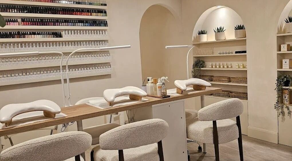 Modern manicure station at Brazilian Soul Beauty in London, England, GB, showcasing elegant design and nail polish display.
