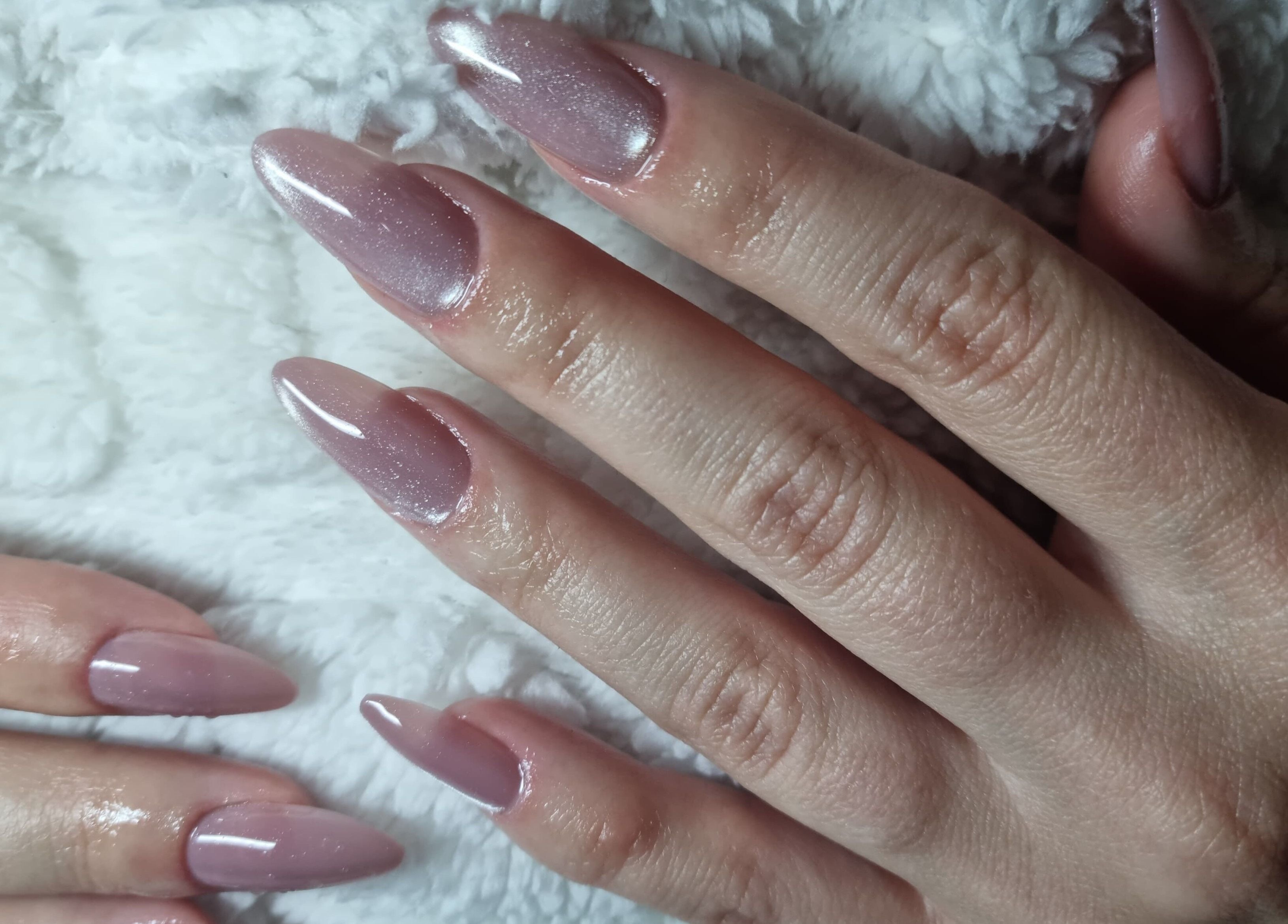 Elegant glittery nails at Beauty To Inspire, Boksburg, Gauteng, ZA, showcasing expert manicure in pink shades.