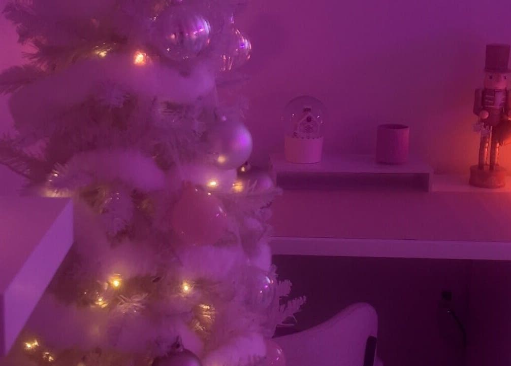 Warm, purple-lit space at Carlene’s Lashes in Courtice, Ontario, CA, featuring a serene holiday decor setup.