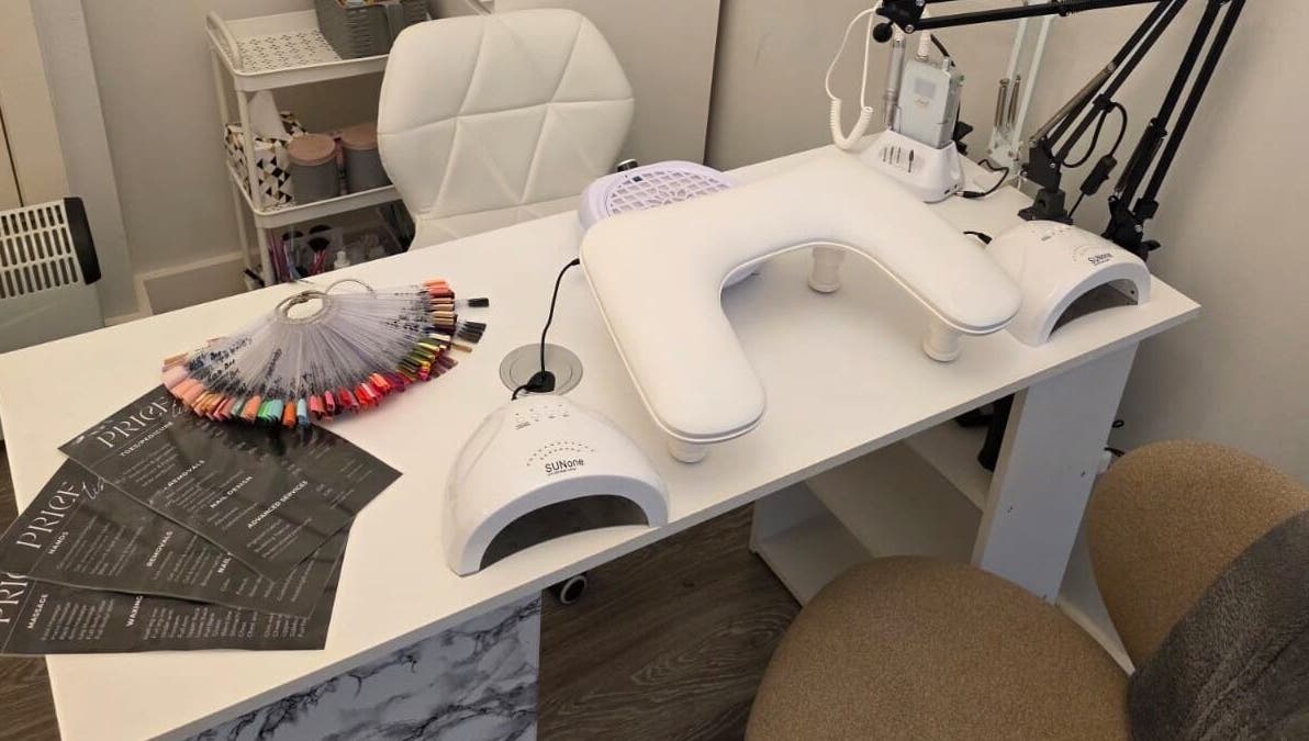 Elegant nail care station at V Beauty World Ltd, Warrington, England, GB showcasing manicure tools and color palette.