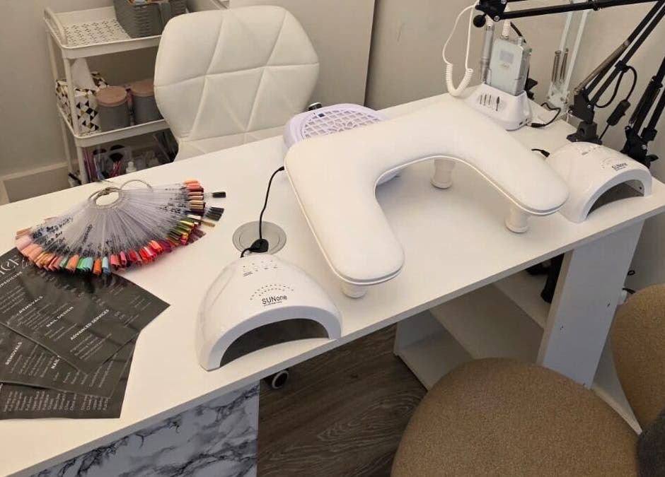 Elegant nail care station at V Beauty World Ltd, Warrington, England, GB showcasing manicure tools and color palette.