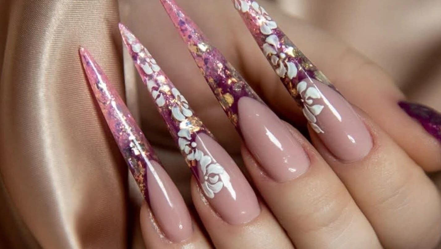 Elegant floral nail art design at V Beauty World Ltd, Warrington, England, GB.