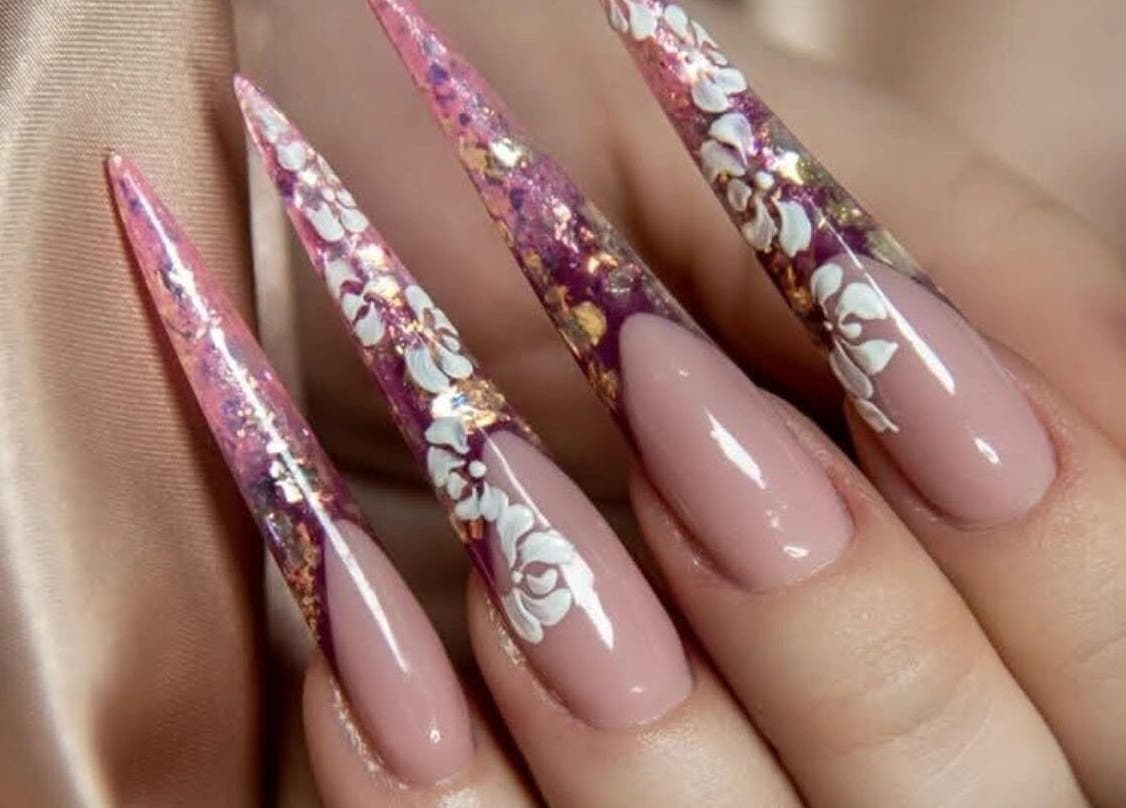 Elegant floral nail art design at V Beauty World Ltd, Warrington, England, GB.