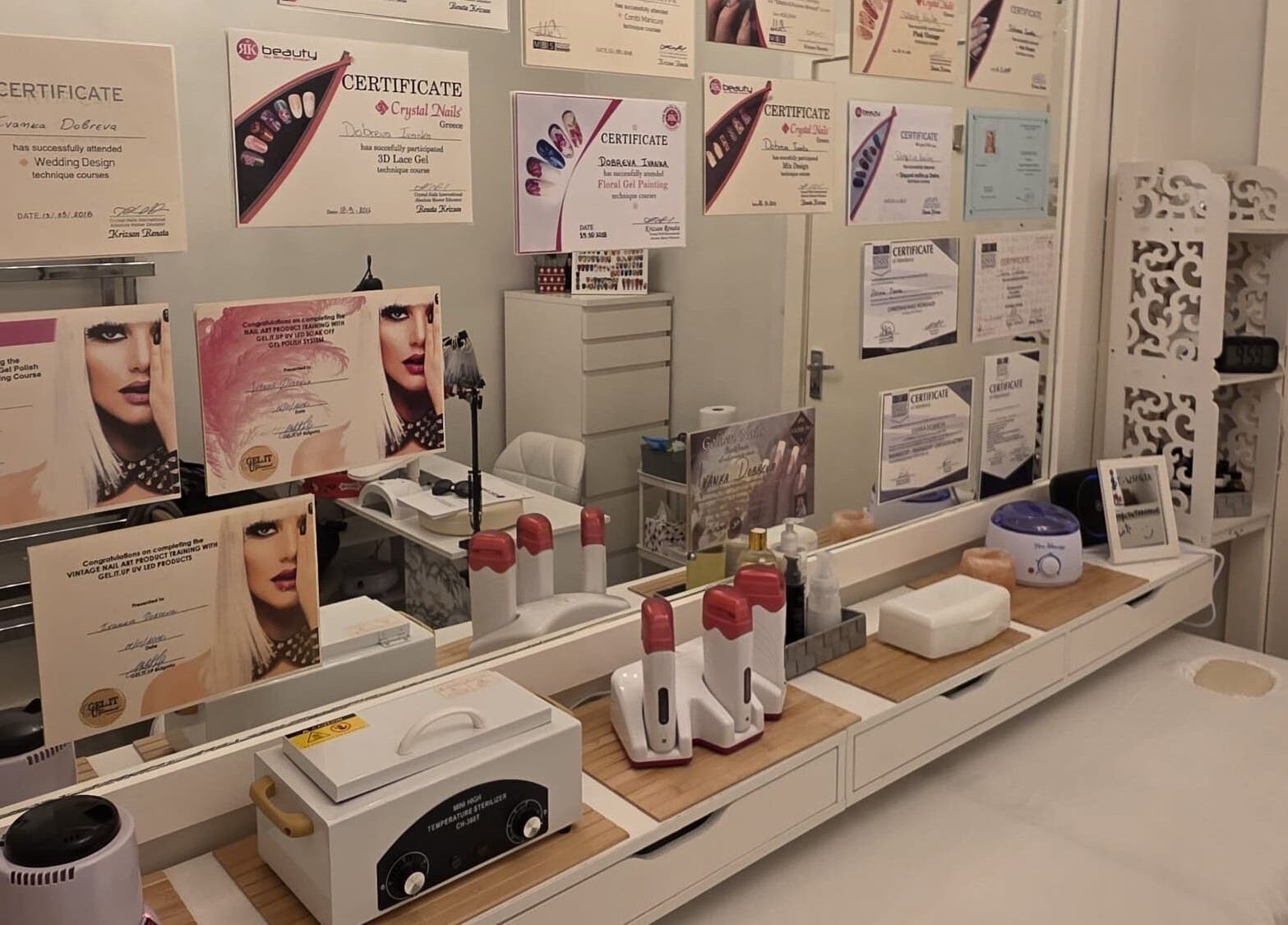 Professional awards display at V Beauty World Ltd, Warrington, England, GB, showcasing various certificates.