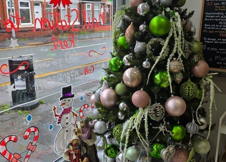 Christmas decorations at V Beauty World Ltd in Warrington, England, GB showcasing festive spirit.