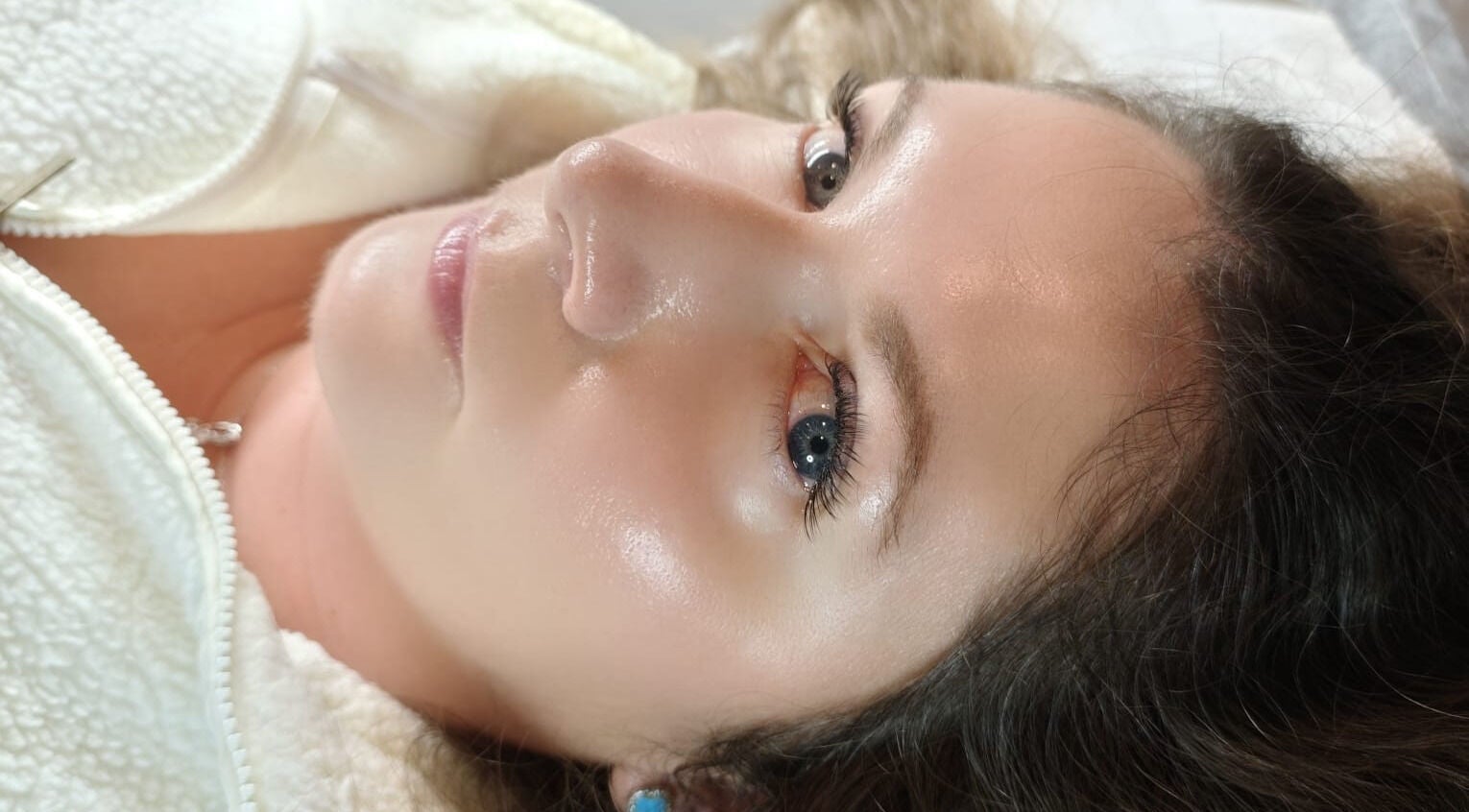 Close-up of a woman with glowing skin at Lashes and Massage by Karina East Preston, East Preston, England, GB.