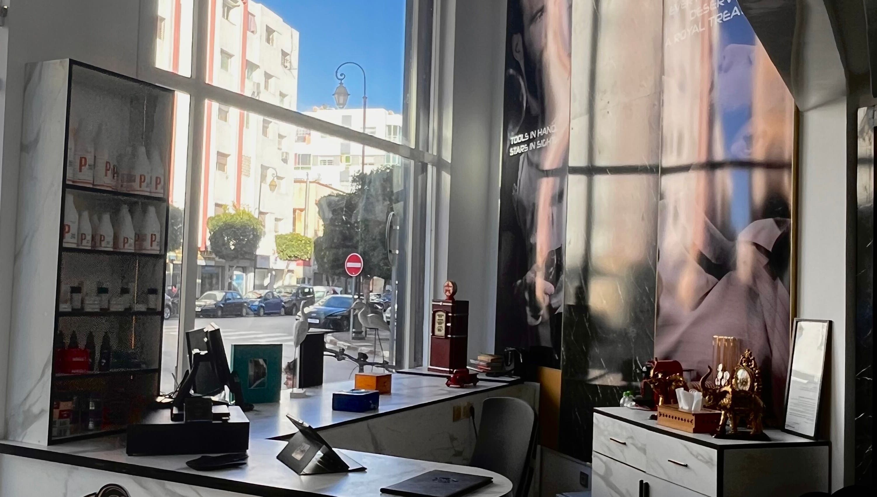 Inside look at Barber's Star showcasing stylish decor and street view in Rabat, Rabat-salé-kénitra, MA.