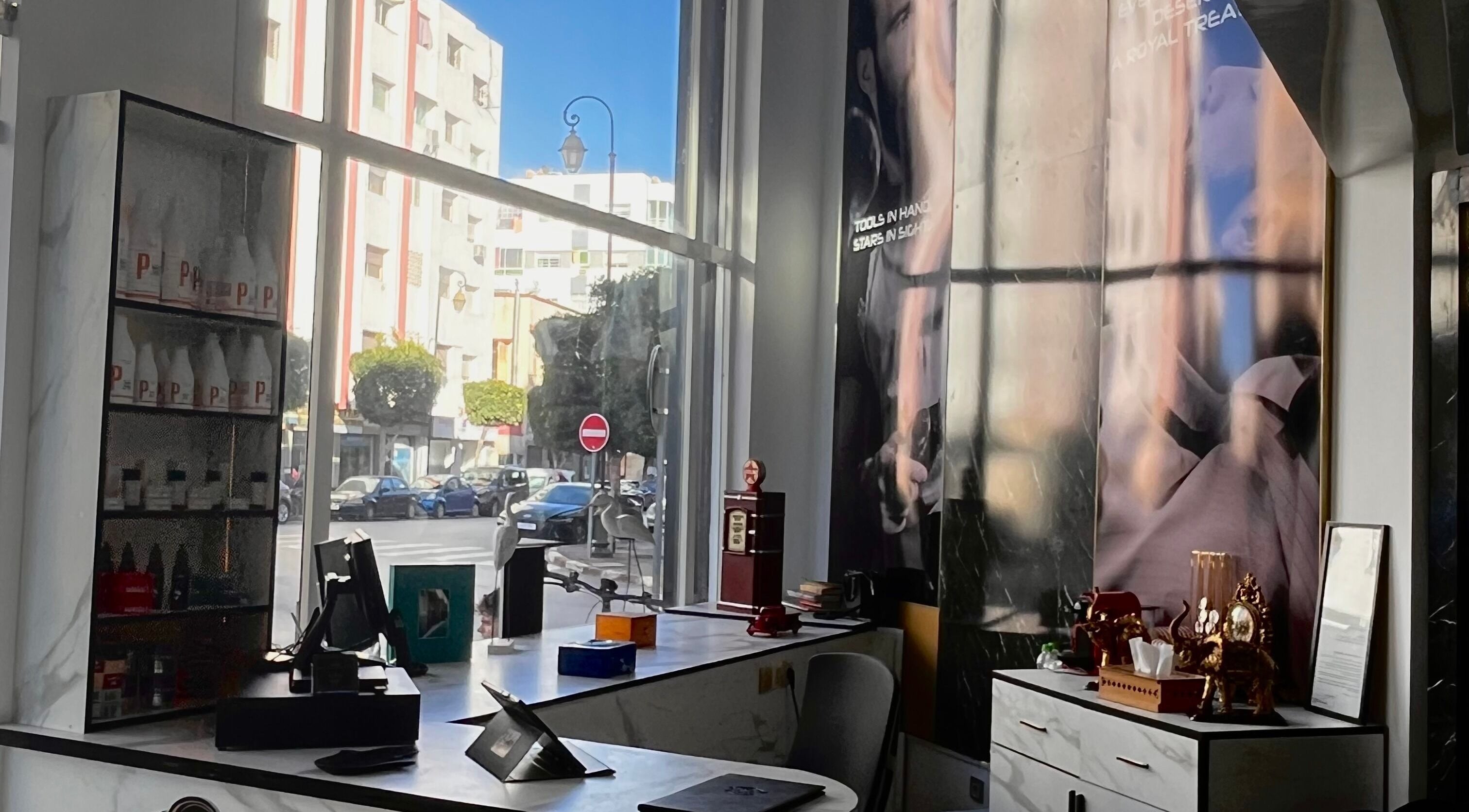 Inside look at Barber's Star showcasing stylish decor and street view in Rabat, Rabat-salé-kénitra, MA.