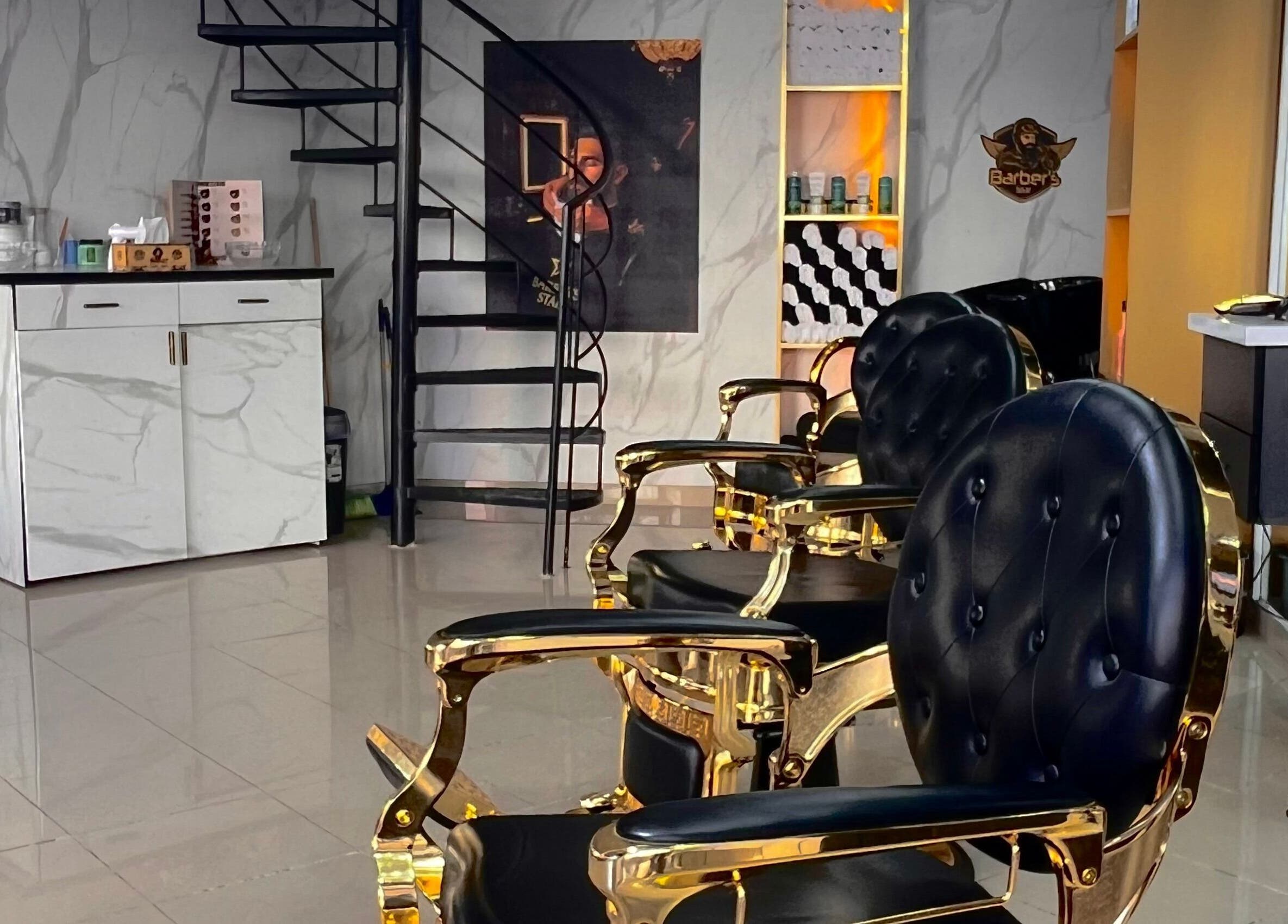 Luxurious gold and black chairs at Barber's Star in Rabat, Rabat-salé-kénitra, MA salon interior.