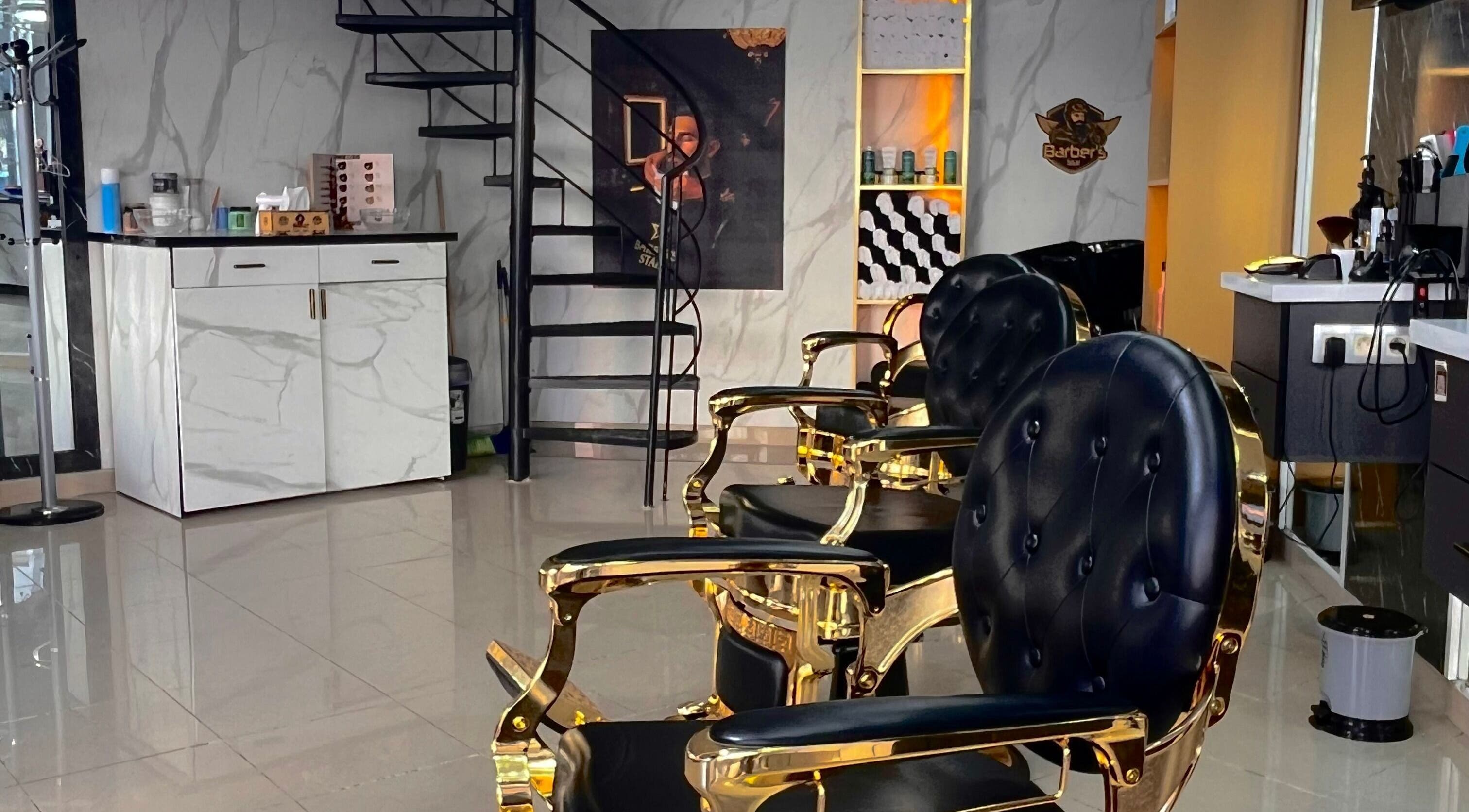 Luxurious gold and black chairs at Barber's Star in Rabat, Rabat-salé-kénitra, MA salon interior.
