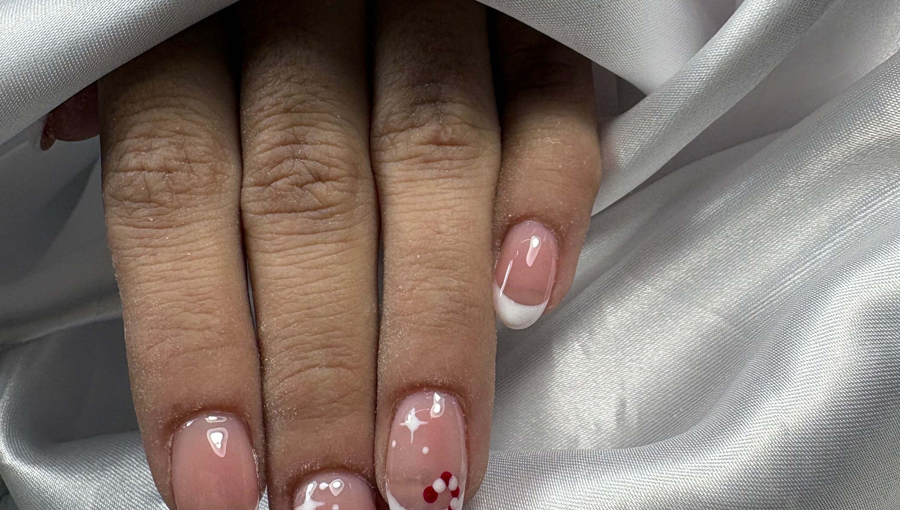 Beautiful French manicure with art at Nails By Carolina, PT.