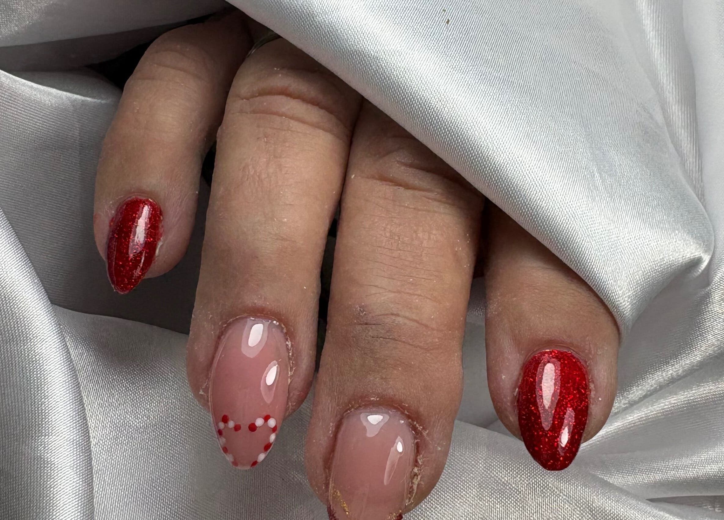 Red and pink glitter nails artfully done at Nails By Carolina, PT