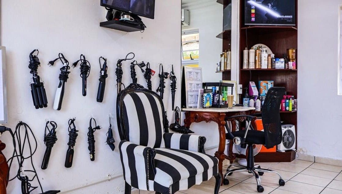 Elegant styling nook at Go Eastern Salon in Gqeberha, Eastern Cape, ZA with tools and products on display.