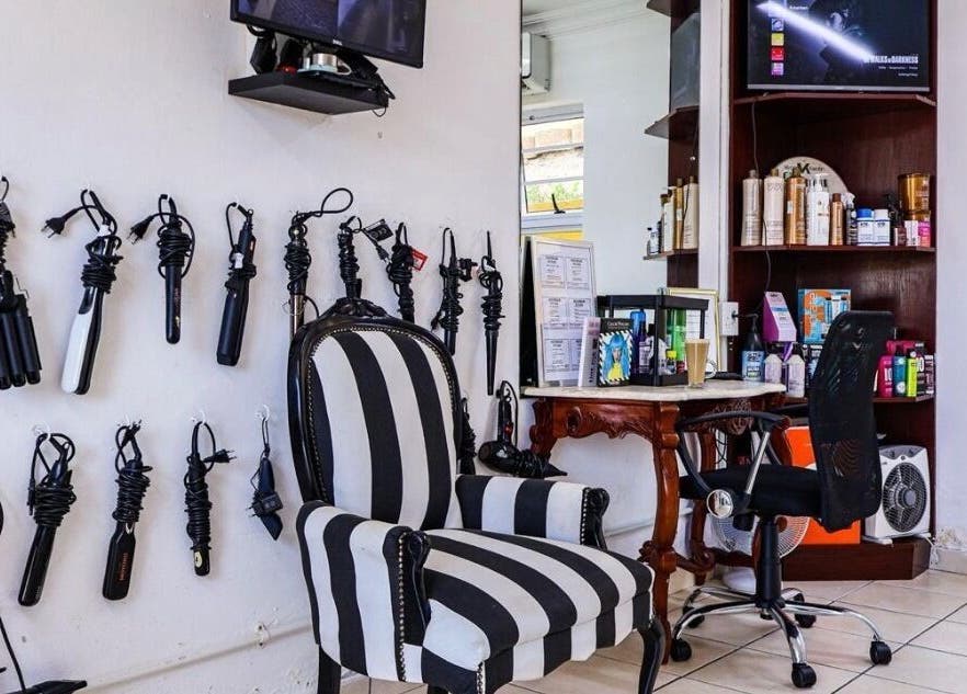 Elegant styling nook at Go Eastern Salon in Gqeberha, Eastern Cape, ZA with tools and products on display.