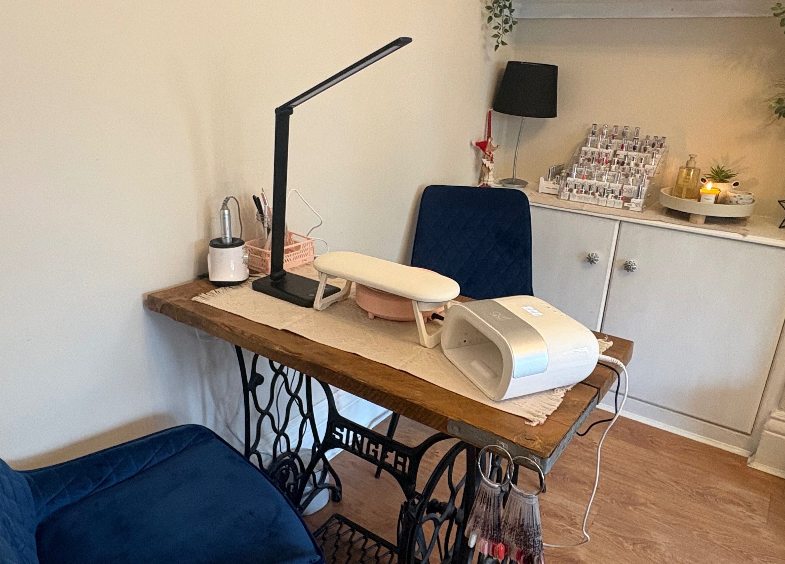 Cozy nail station at Nails by Dena, Blackpool, England, GB, featuring modern tools and plush seating.